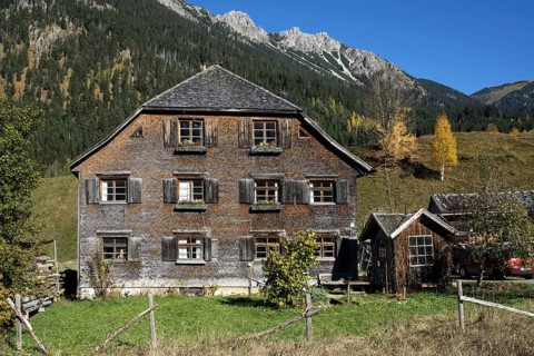 Old Allgau house covered with wooden shingles