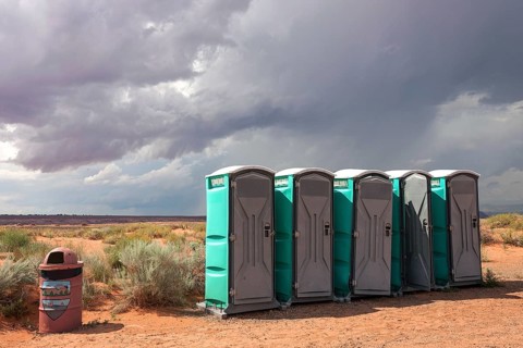 Toilets cubicles in steppe landscape