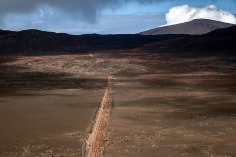 View from the Pas des Sables on the road through the volcanic landscape La Plaine des Sables