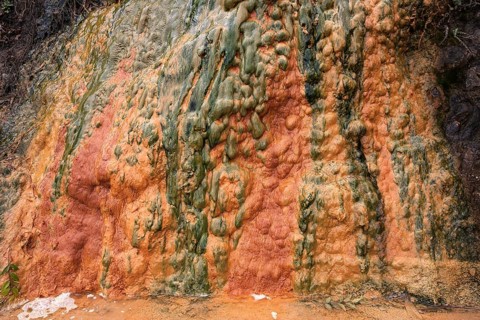 Colored mineral deposits in a thermal spring in Cilaos Cirque de Cilaos