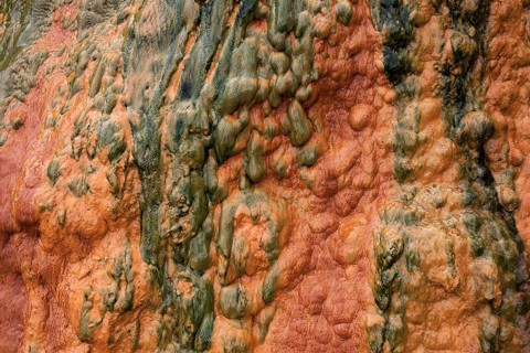 Colored mineral deposits in a thermal spring in Cilaos Cirque de Cilaos