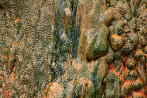 Colored mineral deposits in a thermal spring in Cilaos Cirque de Cilaos