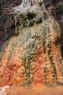 Colored mineral deposits in a thermal spring in Cilaos Cirque de Cilaos