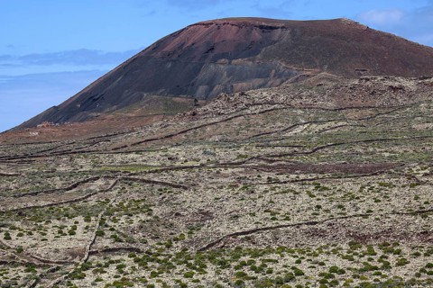 Barren landscape and volcanic mountain Arena in Villaverde
