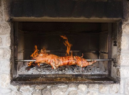 Pigling on spit over the fire
