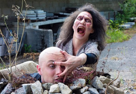 Zombie grabbing the head of a man