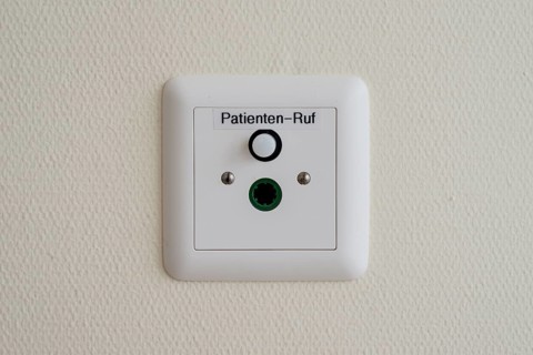 Patient call button on the wall in a German hospital