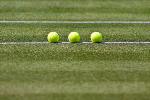 Tennis balls on lawn
