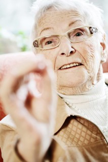 Senior suffering from dementia in her room at the nursing home