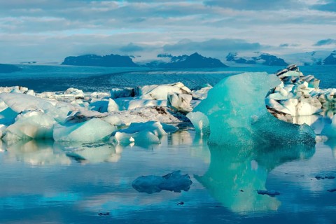 Blue iceberg floating in the lake