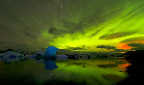 Blue iceberg in Aurora Borealis