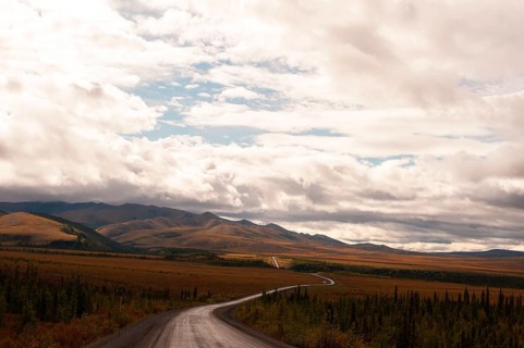 Dempster Highway under clouded sky
