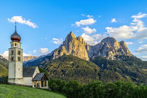 San Valentino church in front of the Schlern and moon at sunset