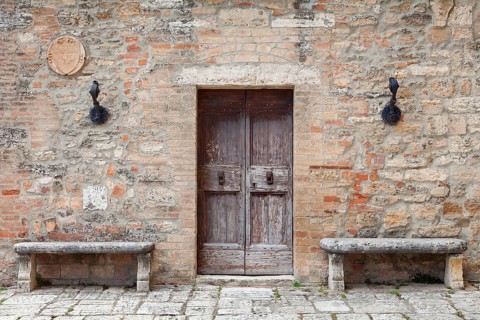 Wooden door and stone benches