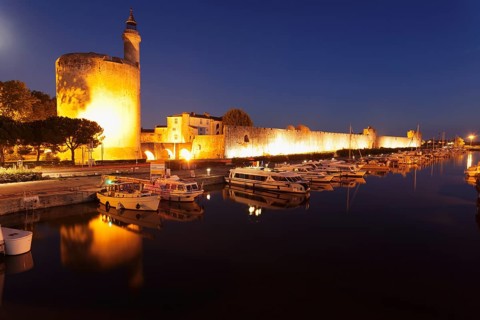 Defence tower Tour de Constance with city walls at night