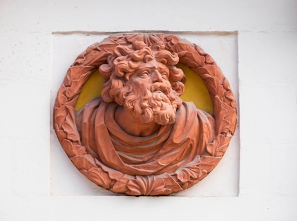 Relief medallion on the external facade of the old palace