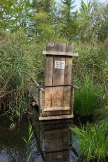 Small jetty with a sign