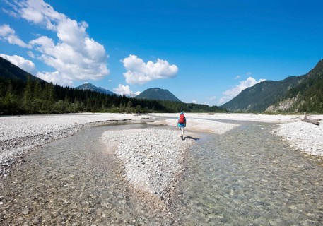 Woman trekking on gravel