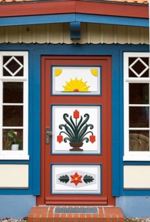 Traditionally painted door of a captain's house
