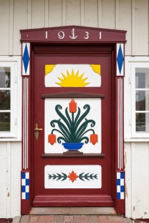Traditionally painted door of a captain's house