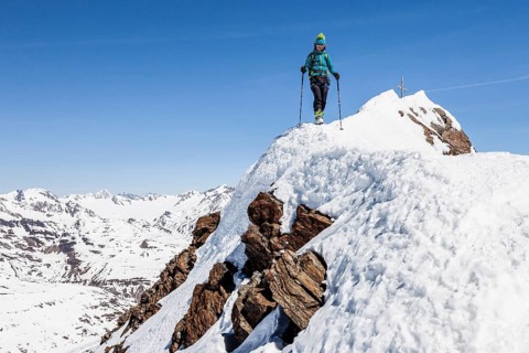 Climber descending from the summit ridge of the Finailspitze peak at Val Senales glacier