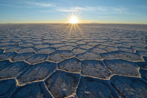 Honeycomb-structure with shadows on a salt lake at sunrise