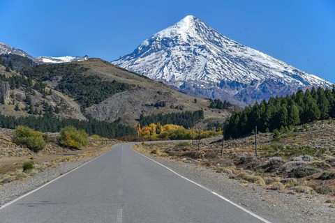 Road with snow covered volcano Lanin