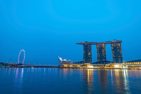 Marina Bay Sands Hotel by the Singapore River at dusk