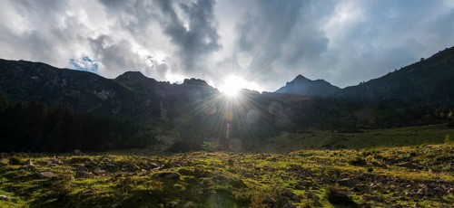 Sun shining over the mountain peak