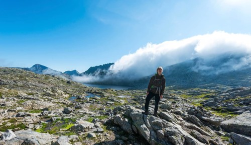 Hiker standing on rock