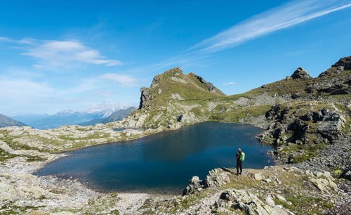 Hiker by a mountain lake