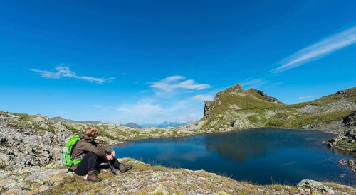 Hiker by a mountain lake