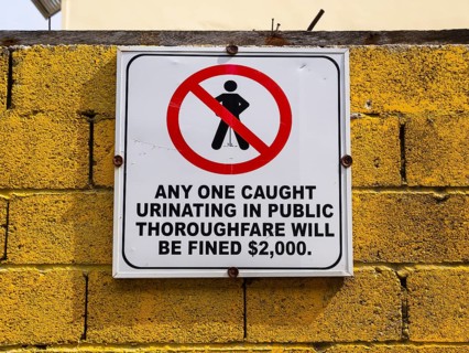 Warning sign against urinating in public