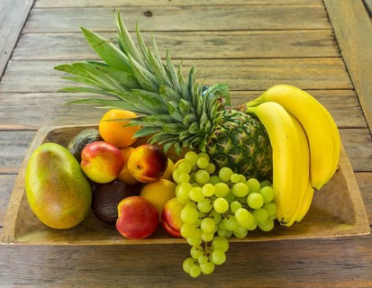 Wooden bowl full of fruit