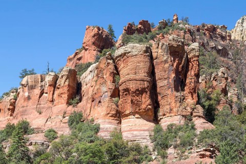 Red rock formations with a face