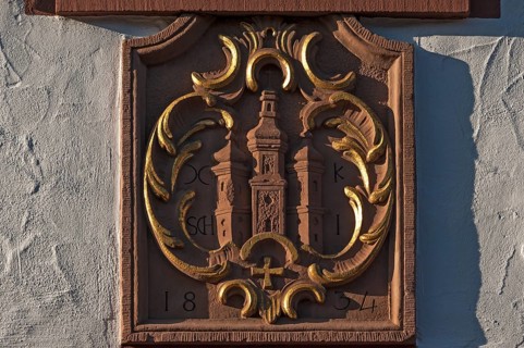 Sandstone relief with the old coat of arms of Ettenheim on a house facade