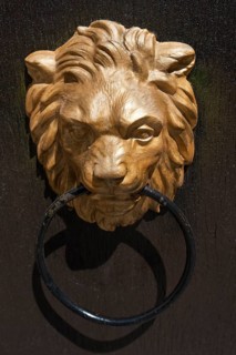 Gilded lion head as door knocker