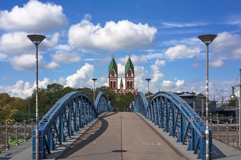 Herz Jesu church behind Wiwilibrucke
