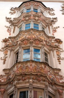 Multistory oriel with baroque stucco