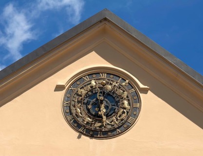 Astrological clock on a house