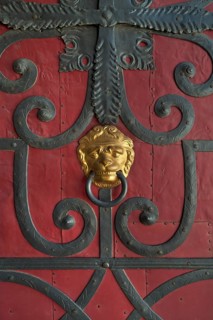 Gilded lion head door knocker