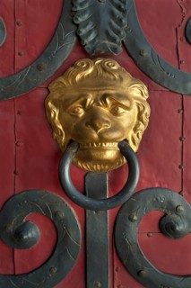 Gilded lion head door knocker