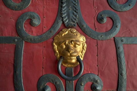 Gilded lion head door knocker