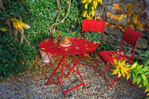 Patio with red garden furniture