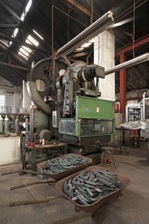 Historical screw press with finished pressed products