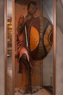 Figure of a Maasai herdswoman from East Africa in a showcase