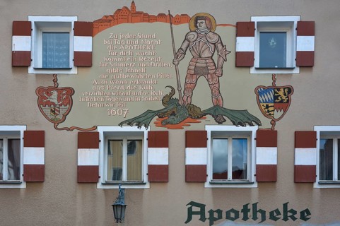 Mural with inscription and the St. George and the Dragon on the town pharmacy