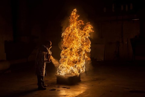 Firefighter extinguishes a heptane 2B-Pan fire with a 2-BTP extinguisher