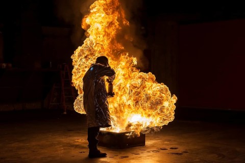 Firefighter extinguishes a heptane 2B-Pan fire with a 2-BTP extinguisher