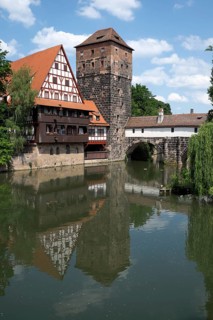 Old timbered houses and hanging tower and bridge
